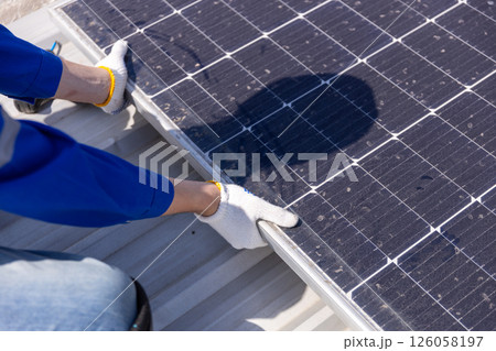 Engineer set installation and inspection standards of solar panels on roof of an industrial factory. Team technician inspection solar cell. Alternative innovation power environmental. Engineer set installation and inspection standards of solar panels on roof of an industrial factory. Team technician inspection solar cell. Alternative innovation power environmental. 126058197