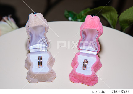 Two pink boxes with a white interior 126058588
