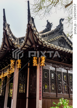 Shanghai, China 1 April 2025: Architectural close-up of Dianchun Hall rooftop in Yuyuan Garden, showcasing ornate Ming Dynasty design with dragon sculptures Shanghai, China 1 April 2025: Architectural close-up of Dianchun Hall rooftop in Yuyuan Garden, showcasing ornate Ming Dynasty design with dragon sculptures 126059457