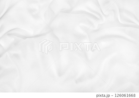Close up top view of white bedding sheet and wrinkle messy blanket in bedroom after wake up in the morning. 126061668