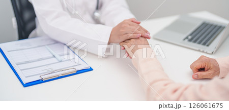 doctor holding hands with elderly female patient, showing empathy and support during a medical consultation. trust, Senior and geriatric care, healthcare, Mental Health, giving advice and emotional 126061675