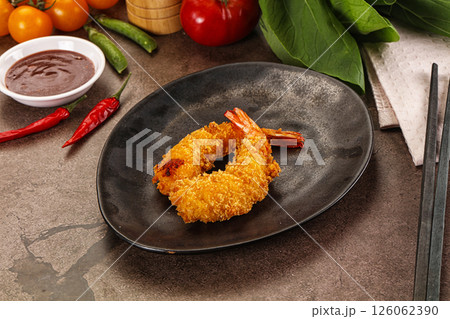 Crispy breaded golden fried prawns 126062390
