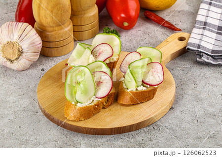 Bruschetta with soft cheese and cucumber Bruschetta with soft cheese and cucumber 126062523