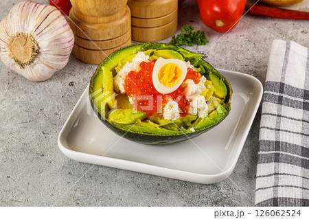 Avocado with red caviar and quil egg Avocado with red caviar and quil egg 126062524