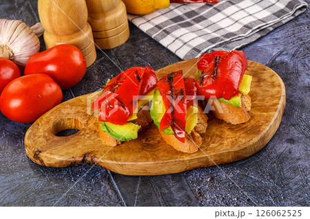 Bruschetta with avocado and grilled pepper Bruschetta with avocado and grilled pepper 126062525