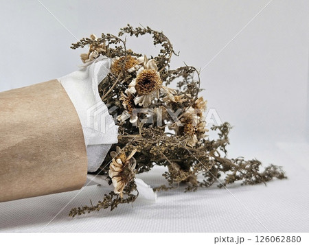 Dried flower bouquet with brown paper bag Dried flower bouquet with brown paper bag 126062880