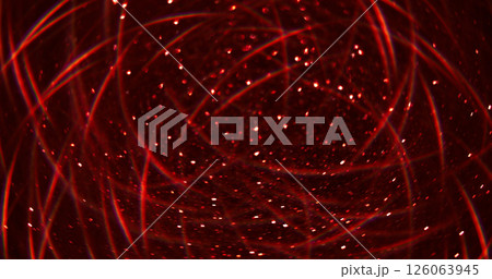 Blur glitter glow. Bokeh effect. Defocused shimmering light red color flash garland gleaming sparks flying on abstract background. Blur glitter glow. Bokeh effect. Defocused shimmering light red color flash garland gleaming sparks flying on abstract background. 126063945
