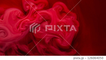 Color water. Paint flow. Blur red pink crimson fluid chemical acrylic sparkling fog glitter emulsion waving on abstract background. 126064050