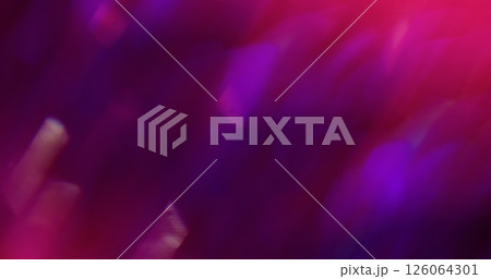 Glow beam. Defocused light abstraction. Multicolor dazzle sparkle purple pink particles lens flare on blurred bokeh background. Glow beam. Defocused light abstraction. Multicolor dazzle sparkle purple pink particles lens flare on blurred bokeh background. 126064301