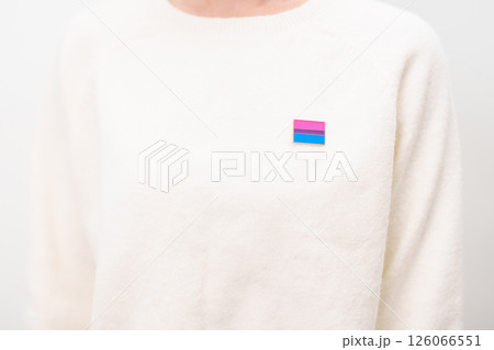 Bisexuality Celebrate Day and LGBT pride month, LGBTQ or LGBTQIA concept. Hand holding purple, pink and blue flag shape for Lesbian, Gay, Bisexual, Transgender, Queer, Pansexual, Marriage Equality Law 126066551