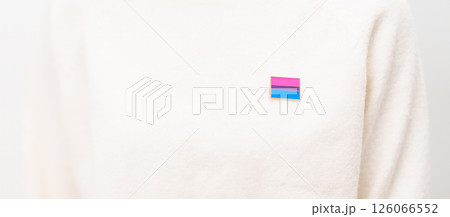 Bisexuality Celebrate Day and LGBT pride month, LGBTQ or LGBTQIA concept. Hand holding purple, pink and blue flag shape for Lesbian, Gay, Bisexual, Transgender, Queer, Pansexual, Marriage Equality Law Bisexuality Celebrate Day and LGBT pride month, LGBTQ or LGBTQIA concept. Hand holding purple, pink and blue flag shape for Lesbian, Gay, Bisexual, Transgender, Queer, Pansexual, Marriage Equality Law 126066552