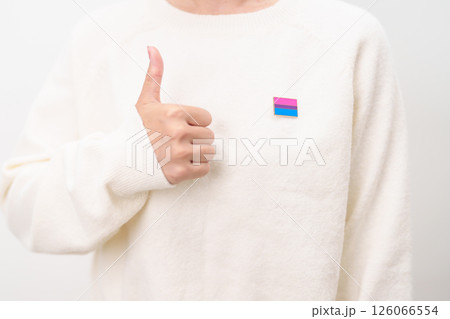 Bisexuality Celebrate Day and LGBT pride month, LGBTQ or LGBTQIA concept. Hand holding purple, pink and blue flag shape for Lesbian, Gay, Bisexual, Transgender, Queer, Pansexual, Marriage Equality Law 126066554