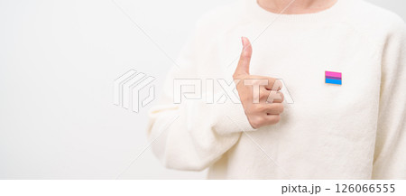 Bisexuality Celebrate Day and LGBT pride month, LGBTQ or LGBTQIA concept. Hand holding purple, pink and blue flag shape for Lesbian, Gay, Bisexual, Transgender, Queer, Pansexual, Marriage Equality Law 126066555