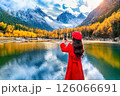 Tourist taking photo of Bipenggou in autumn, Chengdu in China. 126066691