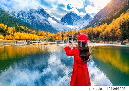 Tourist taking photo of Bipenggou in autumn, Chengdu in China. 126066691