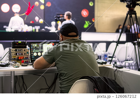 Moscow, Russia - Sept 19, 2023: Behind the scenes of studio set, shooting TV television cooking show featuring celebrity chef, professional TV production. 126067212