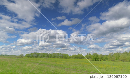 Vibrant Landscape Under a Beautiful, Cloudy Sky A Scene of Natural Wonder and Peacefulness Time lapse. Vibrant Landscape Under a Beautiful, Cloudy Sky A Scene of Natural Wonder and Peacefulness Time lapse. 126067590
