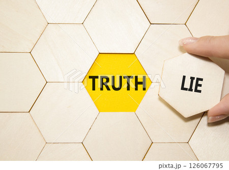 Truth or Lie symbol. Concept word Truth or Lie on wooden puzzle. Businessman hand. Beautiful yellow background. Business and Truth or Lie concept. Copy space Truth or Lie symbol. Concept word Truth or Lie on wooden puzzle. Businessman hand. Beautiful yellow background. Business and Truth or Lie concept. Copy space 126067795