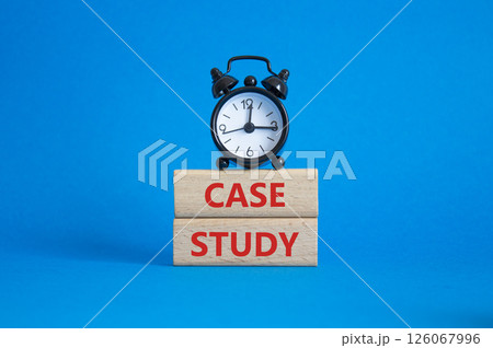 Case Study symbol. Wooden blocks with words Case Study. Beautiful blue background with alarm clock. Business and Case Study concept. Copy space. 126067996