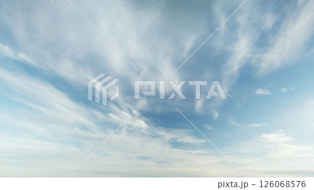 A breathtaking and stunning cloudscape beautifully painted over a clear and bright blue sky 126068576