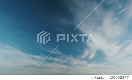 A Serene Sky Displaying Wispy Clouds at Dusk, Enveloping the Evening in Peacefulness 126068577