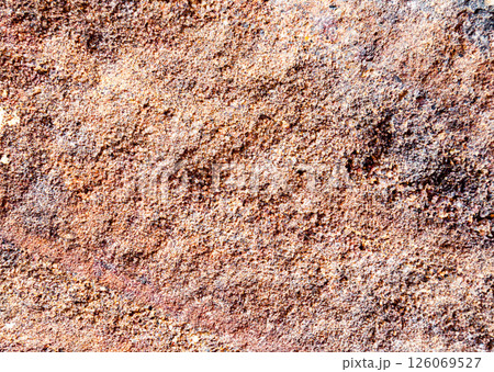 Red rock with porous texture, top view 126069527