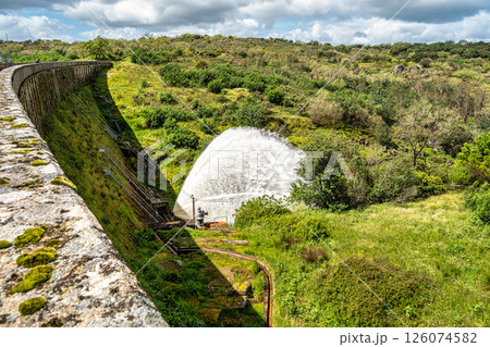 Water sweeping out of the Povoa e Meadas Dam. Natural reserve in Castelo de Vide, Portugal Water sweeping out of the Povoa e Meadas Dam. Natural reserve in Castelo de Vide, Portugal 126074582