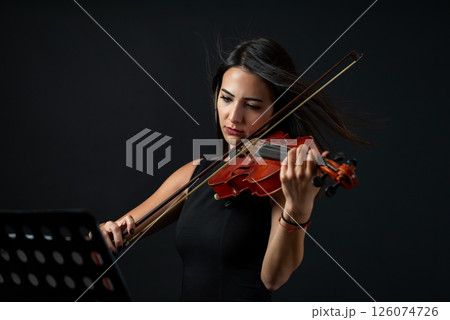 Front view portrait of female musician. 126074726