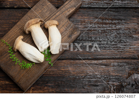 King Oyster Mushroom, Eryngii mushrooms on wooden board 126074807