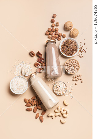 Vegan plant based milk bottles and ingredients. Non dairy drink. Vegan plant based milk bottles and ingredients. Non dairy drink. 126074865