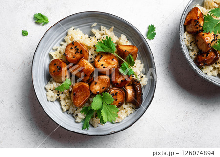 Stir fried teriyaki eryngii mushrooms with rice Stir fried teriyaki eryngii mushrooms with rice 126074894