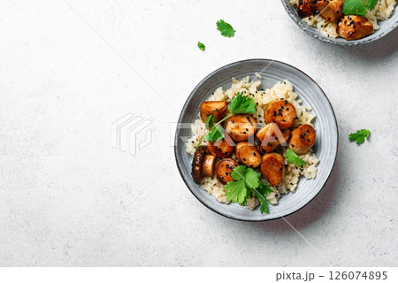 Stir fried teriyaki king oyster mushrooms with rice 126074895