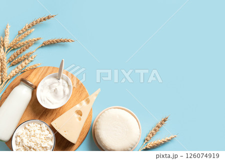 Various dairy products and wheat ears. Happy Shavuot. 126074919