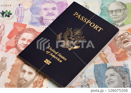 American passport on Colombian money 126075208