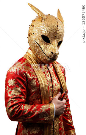 Person Wearing Ornate Gold Lizard Mask Robe Isolated A medium shot photo shows a person whose identity is hidden behind 126075460