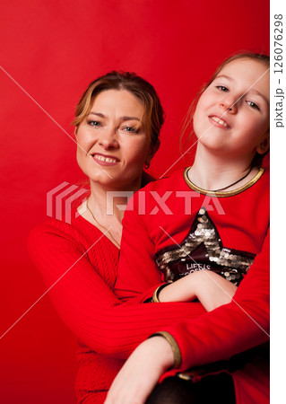 Portrait of mother and daughter 10 years old smiling 126076298