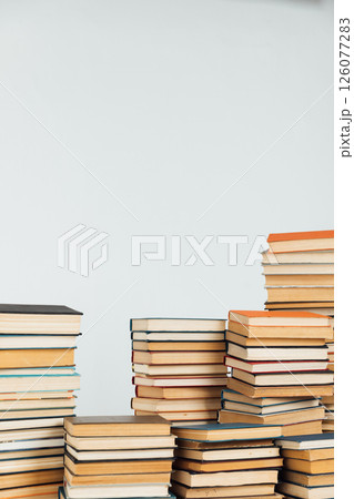 Stacks of educational books for learning on a white background 126077283