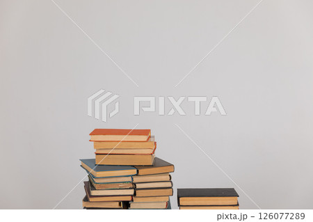 Stacks of educational books for learning on a white background Stacks of educational books for learning on a white background 126077289