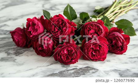 Elegant bouquet of red roses on marble surface for romantic occasions 126077690