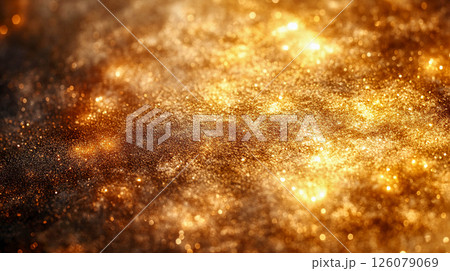 Abstract background consisting of lots of golden sparks and blurred glowing elements. The texture looks like shimmering gold dust or a starry sky.	 126079069