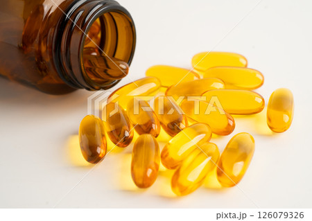 Fish oil or Cod liver oil gel in capsules with omega 3 vitamins, supplementary healthy food. 126079326
