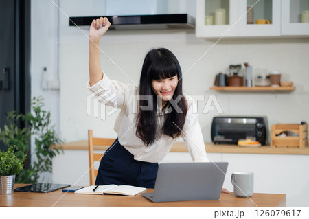 lifestyle of office workers, Woman successful sitting in the kitchen. 126079617