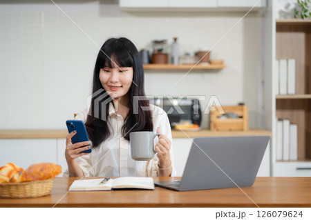 lifestyle of office workers, Woman successful sitting in the kitchen. lifestyle of office workers, Woman successful sitting in the kitchen. 126079624