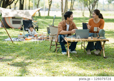 Happy asian family picnic in park, weekend lifestyle outdoors. 126079728