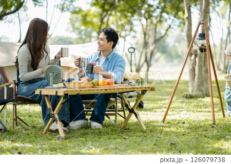 Happy asian family picnic in park, weekend lifestyle outdoors. Happy asian family picnic in park, weekend lifestyle outdoors. 126079738