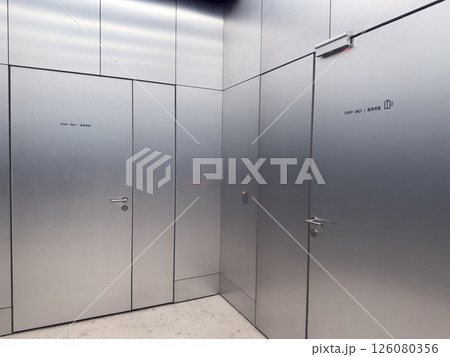 Closed metallic staff doors with service elevator sign and card reader. Restricted access area in modern public space. Concept of workplace safety and authorized personnel only Closed metallic staff doors with service elevator sign and card reader. Restricted access area in modern public space. Concept of workplace safety and authorized personnel only 126080356