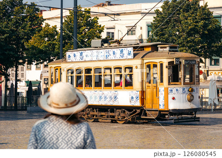 Tourist admires the iconic tram in Porto, Portugal Tourist admires the iconic tram in Porto, Portugal 126080545