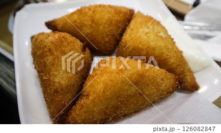 close up of Cantonese snacks deep fried shrimp toast cut into rectangular shape ordered in Cha chaan teng cafe 126082847