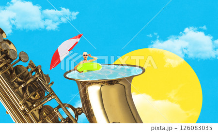 Woman in swimsuit with umbrella and float sits inside giant saxophone bell filled with water under sun and clouds. Woman in swimsuit with umbrella and float sits inside giant saxophone bell filled with water under sun and clouds. 126083035
