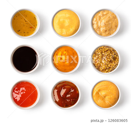 Set of various sauces in bowls, isolated on white background, top view 126083605